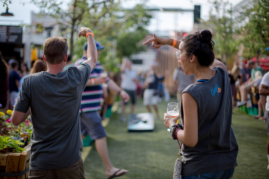 playing bags at great divide block party